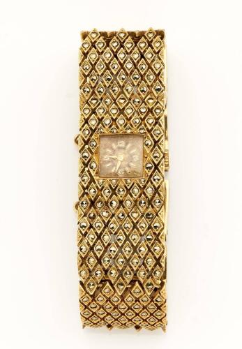 A Lady's gold and marcasite bracelet watch, Felea, circa 1960's. Manual. 21mm. Square textured dial with applied baton and Arabic numerals. Integral mesh bracelet. 9ct yellow gold. Weight 55.11 grams. Length 17cm. 