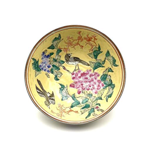 A Chinese Yellow Ground Famille Rose 'Floral and Bird' Bowl