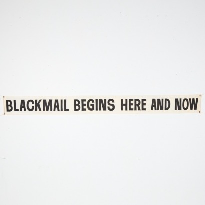 A 'Blackmail Begins Here And Now' Banner