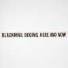 A 'Blackmail Begins Here And Now' Banner
