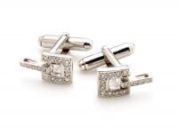 A pair of gold and diamond cufflinks. 18ct white gold and silver. Weight 5.96 grams. Length 27mm.