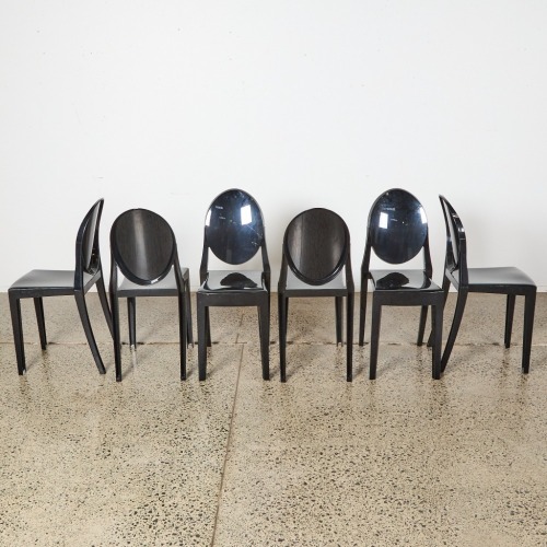 A Suite Of Six Kartell Style Black Ghost Chairs