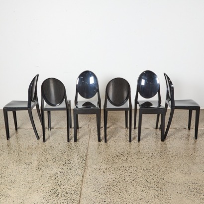 A Suite Of Six Kartell Style Black Ghost Chairs