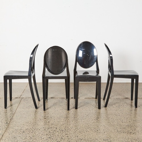 A Set Of Four Kartell Style Black Ghost Chairs