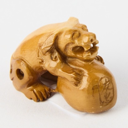 A Laquered Netsuke of a Dog