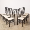 A Suite of Eight Charles Rennie Mackintosh Style Ladder Back Chairs