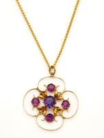 An Edwardian amethyst pendant on chain, of circular pierced design. 9ct yellow gold. Weight 3.6 grams.