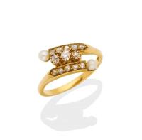 An antique diamond and natural pearl crossover ring. 18ct yellow gold. Weight 2.96 grams. Size K ½.