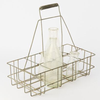 A Vintage Milk Crate with Four Assorted Bottles