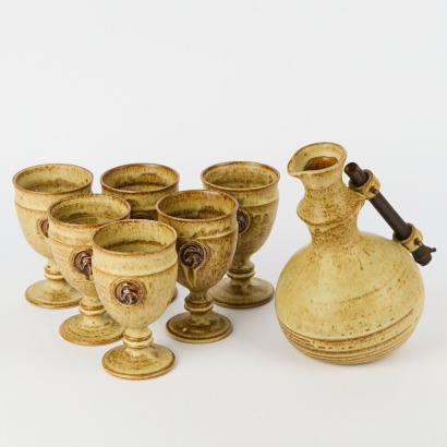 A George Gledhill Pottery Jug with Six Embossed Mugs
