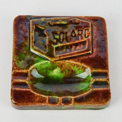 An Olive Jones Solarc Batteries Advertising Ashtray