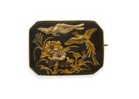 A vintage Shakudo brooch, the octagonal panel inset with floral and bird motifs. Silver gilt frame. Weight 16.77 grams. Length 37mm. Width 29mm.