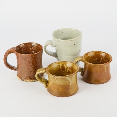 A Collection Of Four Wonky Handmade Coffee Cups