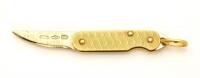 An Italian gold penknife charm, yellow gold blade. 18ct yellow gold. Weight 3.36 grams. Length 25mm.