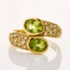 18ct Yellow Gold, Oval Peridot / Clear Stone Cross Over Ring