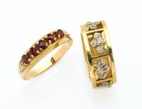 Two gold rings, one a wide pierced band with diamond set floral motifs, the other a garnet bridge ring. 9ct yellow gold. &nbsp;Combined weight 9.7 grams. Sizes V and O.
