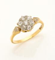 An antique diamond cluster ring, set with seven old European cut diamonds. 18ct yellow gold. Weight 2.84 grams. Size N.