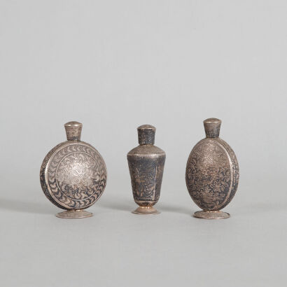 A Group of Three Chinese Silver Incised Snuff Bottles