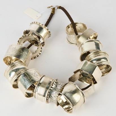 A Set of 14 Sterling Silver Napkin Rings