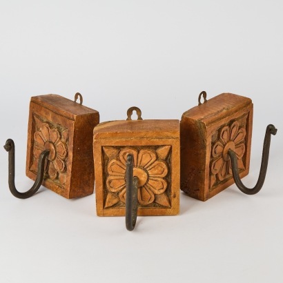 A Set of Three Carved Hooks