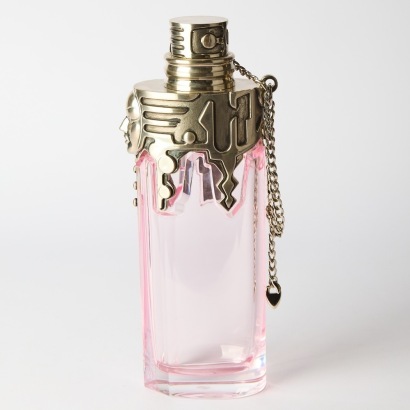 A Counter Display of Bottle of Womanity by Thierry Mugler