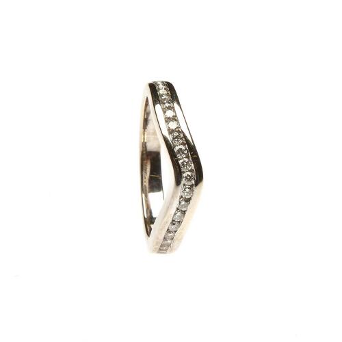 A diamond band ring, the shaped band, channel set with twenty-one round brilliant cut diamonds. 18ct white gold. Weight 5.62 grams. Size M.