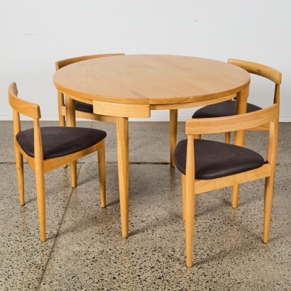 A Hans Olsen Roundette Style Dining Table With Four Nested Chairs