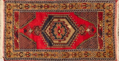 A Hand-Knotted Vintage Turkish Rug