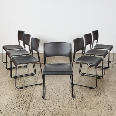 A Set of Six Plastic and Metal Stackable Chairs