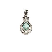 An emerald and diamond pendant, set with an oval emerald of known weight 0.88 carat and single cut diamonds of total weight 0.21 carats. 18ct white gold. Weight 1.63 grams. Length 25mm. Accompanied by NGTC Identification Certificate.