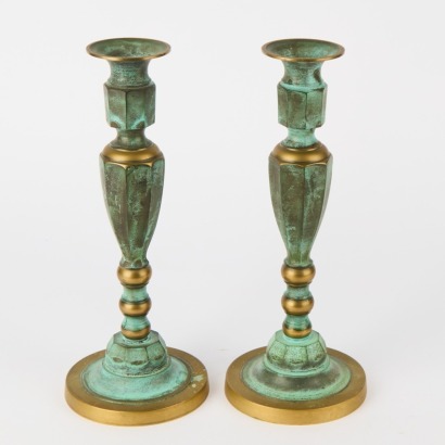 A Pair of Brass Gothic Candle Holders with Patina