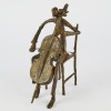 A Bronze Sculpture of a Cellist Musician