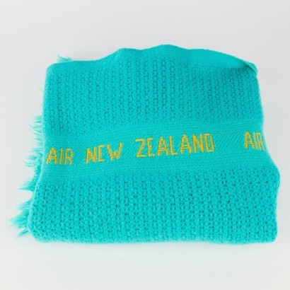 A Retro Teal Air New Zealand Travel Rug