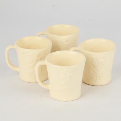 A Set of Four Rae Dunn Crucifix Coffee Cups