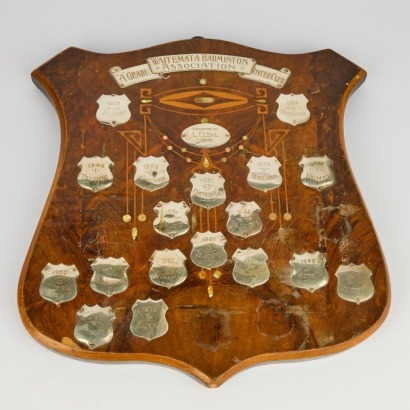 A Wooden Trophy Shield with Sterling Silver Shields