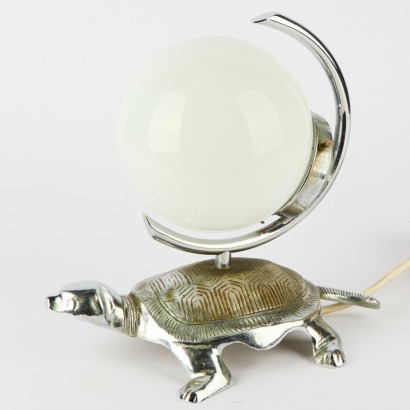 An Art Deco Chrome Tortoise Lamp With An Opaque Glass Globe