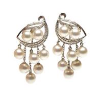 A pair of cultured pearl pendant earrings. Silver. Weight 15.6 grams. Length 4cm. Post attachments.