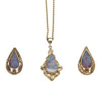 An Edwardian opal suite, comprising pendant and earrings, each set with pear-shaped opal doublets, foliate motifs to surround. 9ct yellow gold. Total weight 9.41 grams. Length of chain 50cm. Pendant length 35mm.