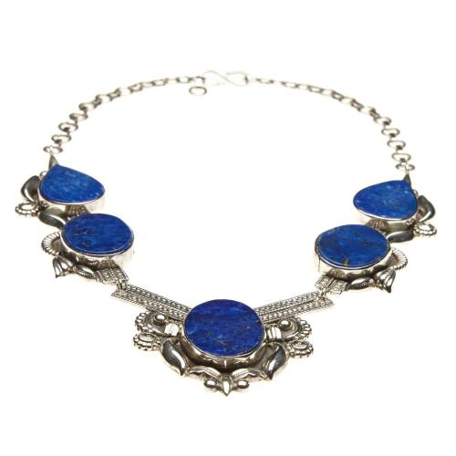 A silver and lapis lazuli collar, of articulated design, and set with five lapis panels in a decorative mount. 925 silver. Weight 80 grams.