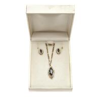 A sapphire and diamond suite, the marquise cut blue sapphire and diamond pendant on chain to be sold with matching cluster earrings. 14ct yellow gold. Weight 9.44 grams.