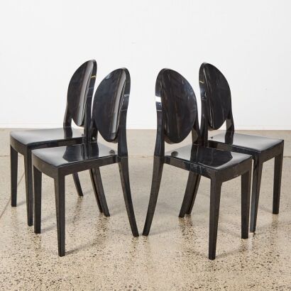 A Suite of Four Kartell Style Black Ghost Chairs