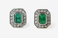 A pair emerald and diamond earrings, the step cut emeralds of estimated total weight 1.68 carats in a rubover setting each surrounded by an octagonal border of 16 bead set round brilliant cut diamonds. 9ct yellow and white gold. Weight 3 grams. Post and b