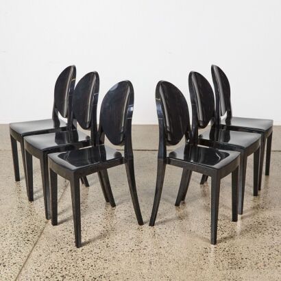 A Suite of Six Kartell Style Black Ghost Chairs