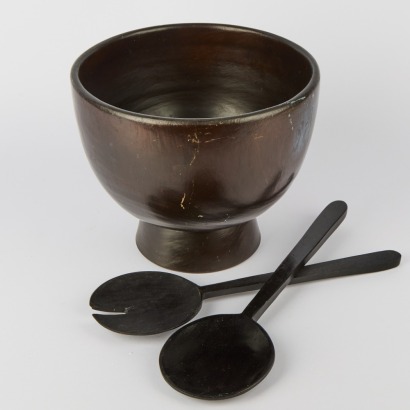 A Large Wooden Salad Bowl with Servers