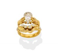 A solitaire diamond ring, the pear-shaped diamond of estimated weight 1.20 carat. 18ct yellow gold. Weight 4.3 grams. Size H. To be sold with a fitted diamond band, set with four round brilliant diamonds and two pear-shaped diamonds. Total estimated diamo