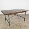 A Hardwood and Iron Dining Table