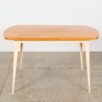 An Industrial Mid Century Dining Table With Solid Wood Top