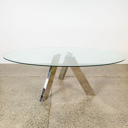 A Former Italy Glass and Chrome Oval Dining Table
