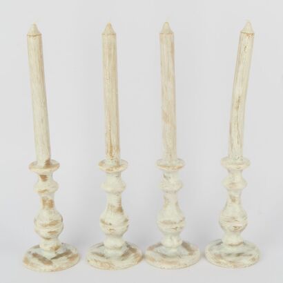 A Set Of Four Of Large Formed Table Candles
