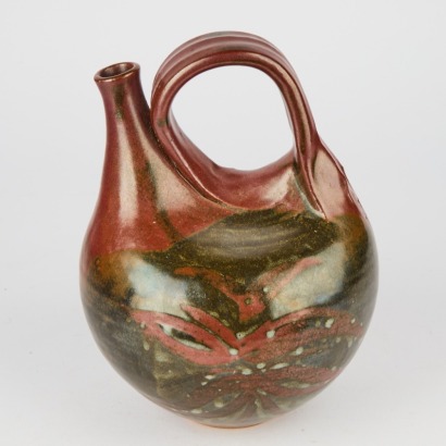 A Helen Mason Stoneware Ceremonial Pourer In A Tenmoku Glaze With Blossom Wax Resist Decoration